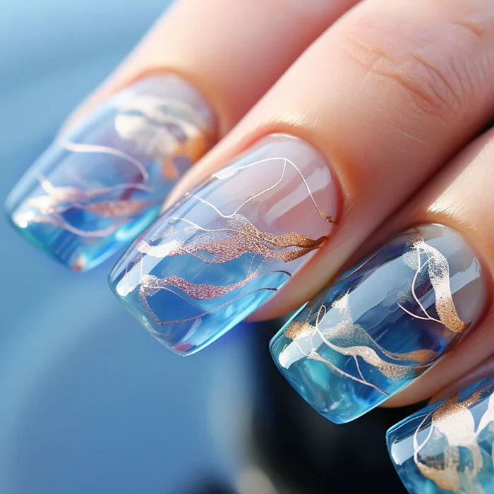 Translucent Blue and White Marble Press On Nails With Gold Wave Accents