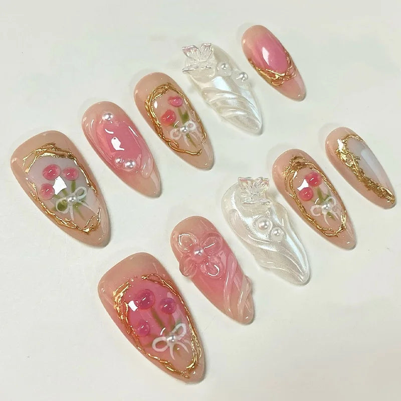 Translucent Peach Pink Cherry Nails With Raised Gold and Pearl Details