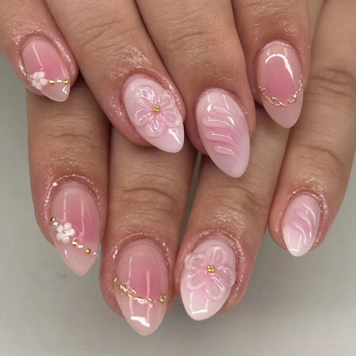 Translucent Pink French Tip Nails With 3D Flowers, Pearls and Gold Accents