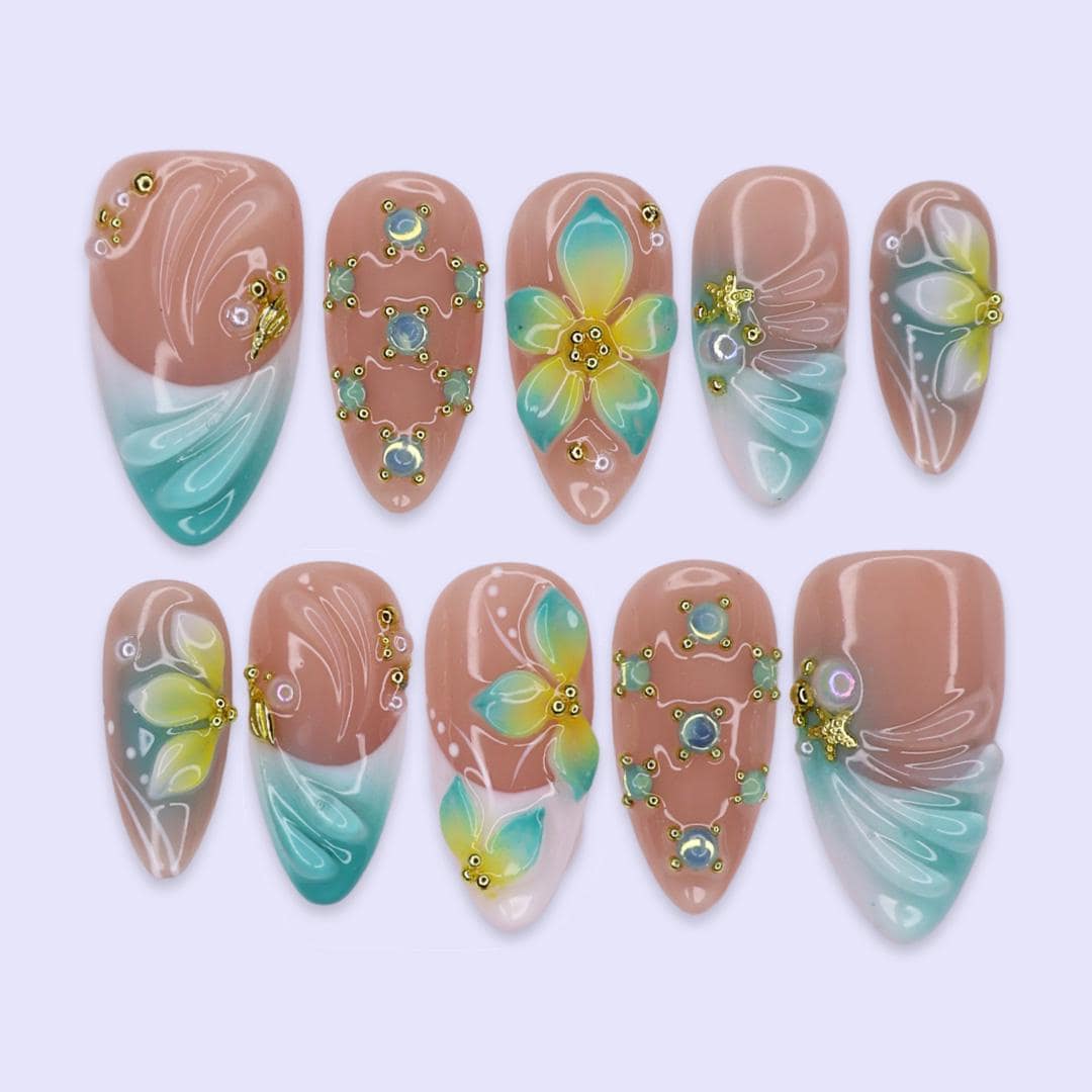 Tropical Flower and Shell Line-Art Nails with Aqua Tips and Gold-Toned Details
