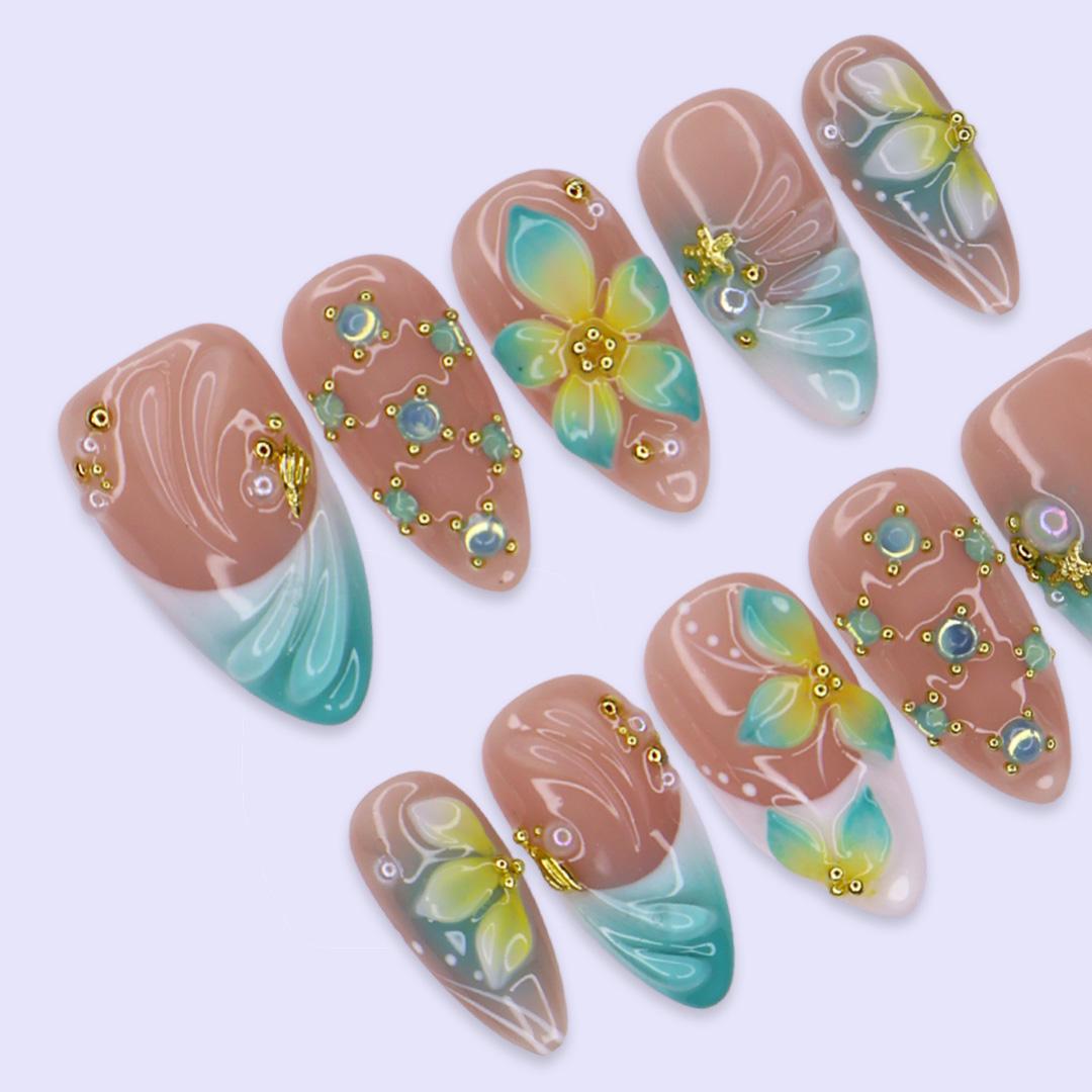 Tropical Flower and Shell Line-Art Nails with Aqua Tips and Gold-Toned Details