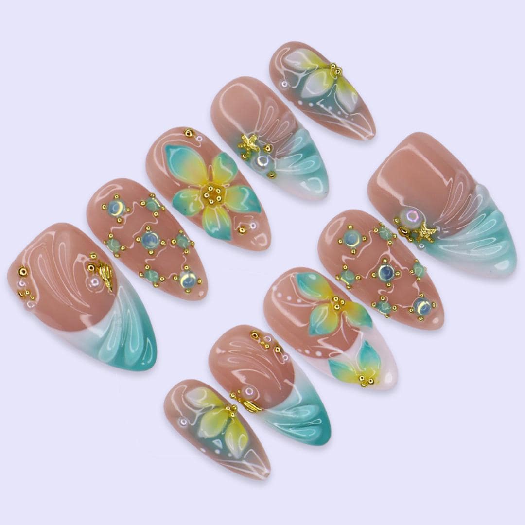 Tropical Flower and Shell Line-Art Nails with Aqua Tips and Gold-Toned Details