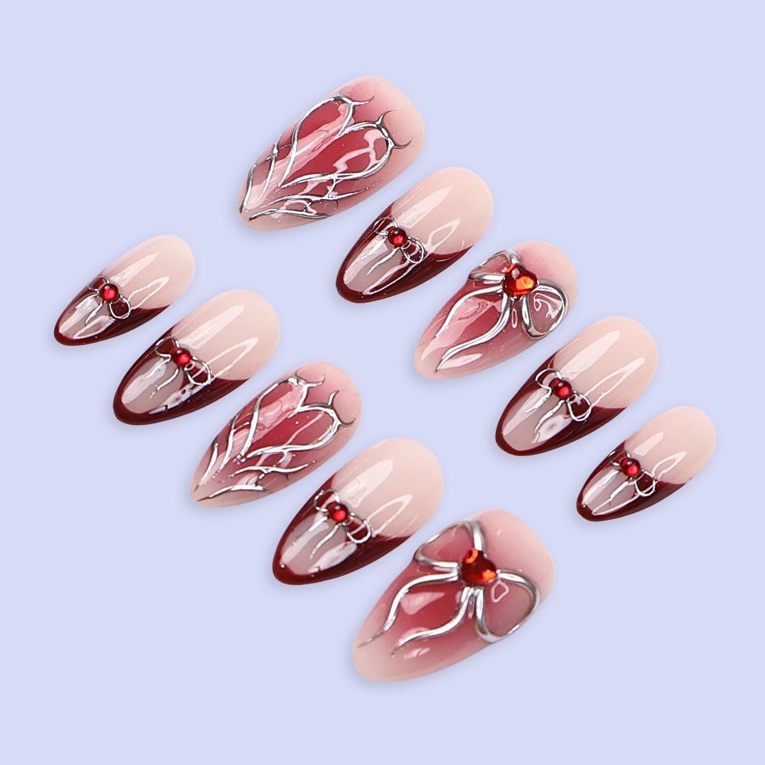 Valentine Nude Pink and Red French Tip Nails with Silver Bow and Heart Motifs