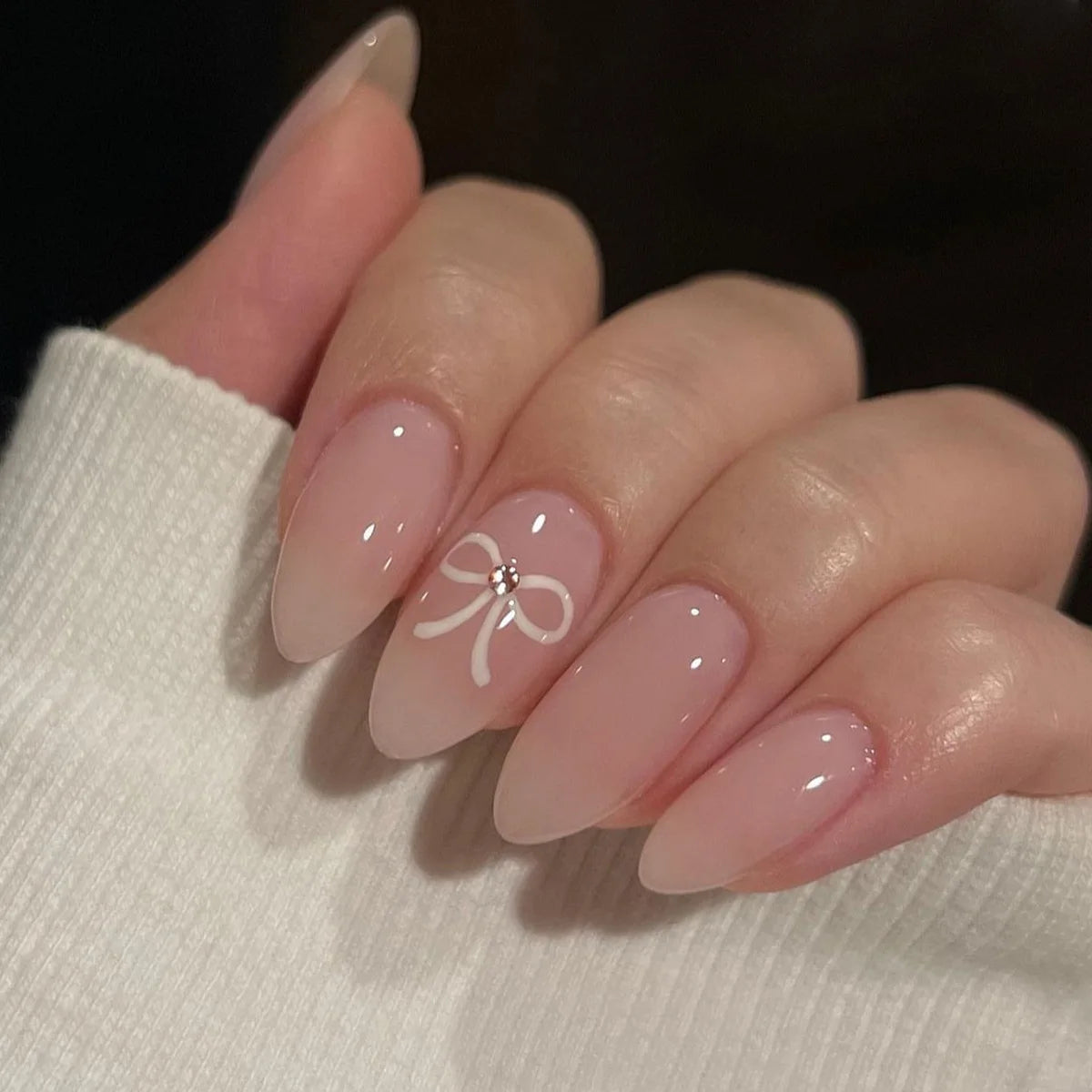 Valentine's Day Sheer Nude Pink French Tip Nail Set with White Bow and Rhinestone