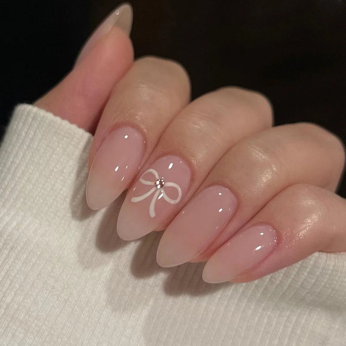 Valentine's Day Sheer Nude Pink French Tip Press On Nail Set with White Bow and Rhinestone