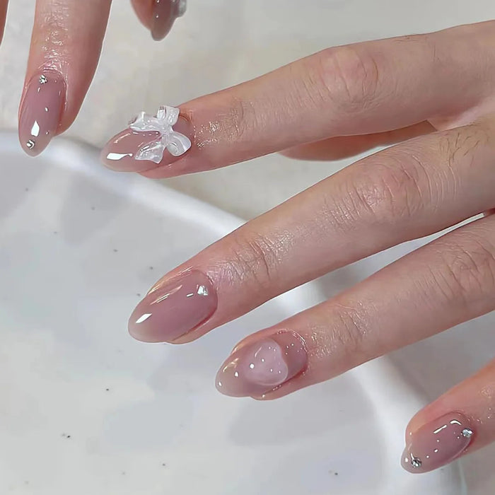 Valentine's Day Sheer Nude Pink Press On Nails with White Bow Charm and Silver Rhinestones