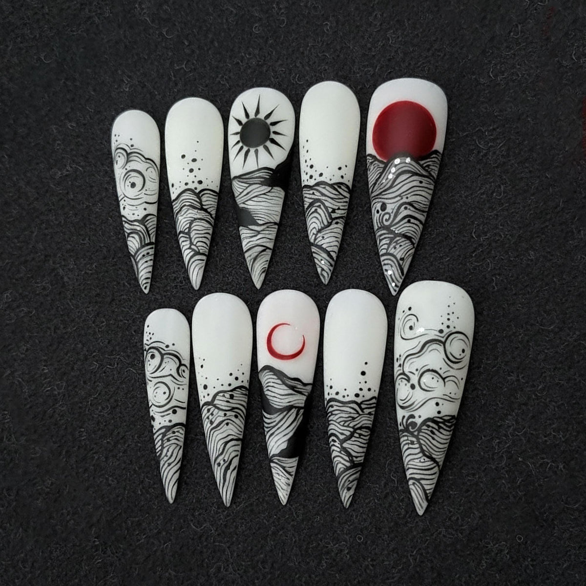 White and Black Celestial Wave Line Art Press On Nails with Red Sun Accents