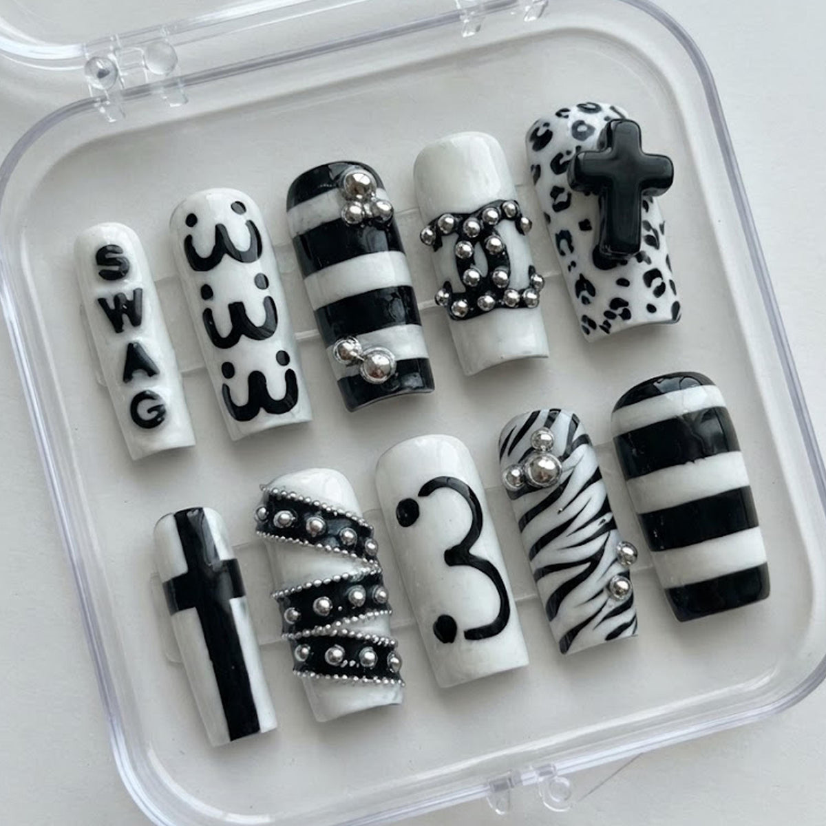 Y2K Black and White Animal Print Nails with Raised Crosses and Silver Chain Details