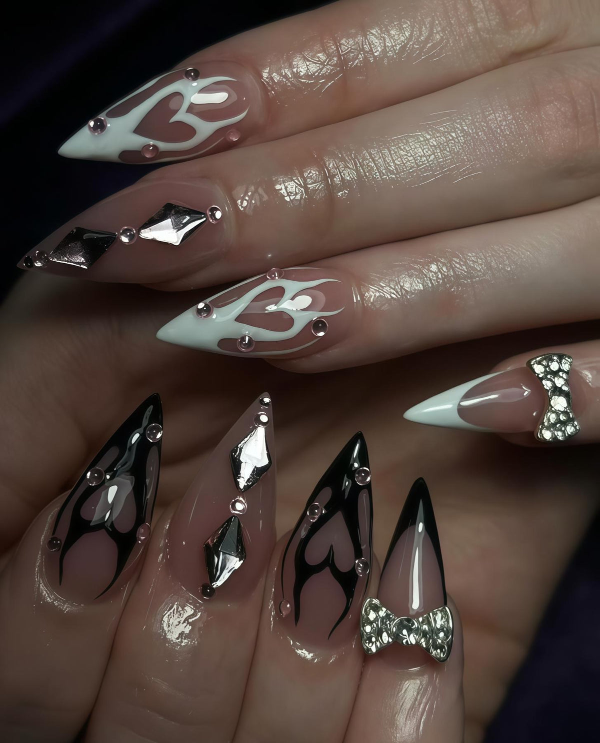 Y2K Black and White Flame Nails with Silver Charms and Rhinestone Bows