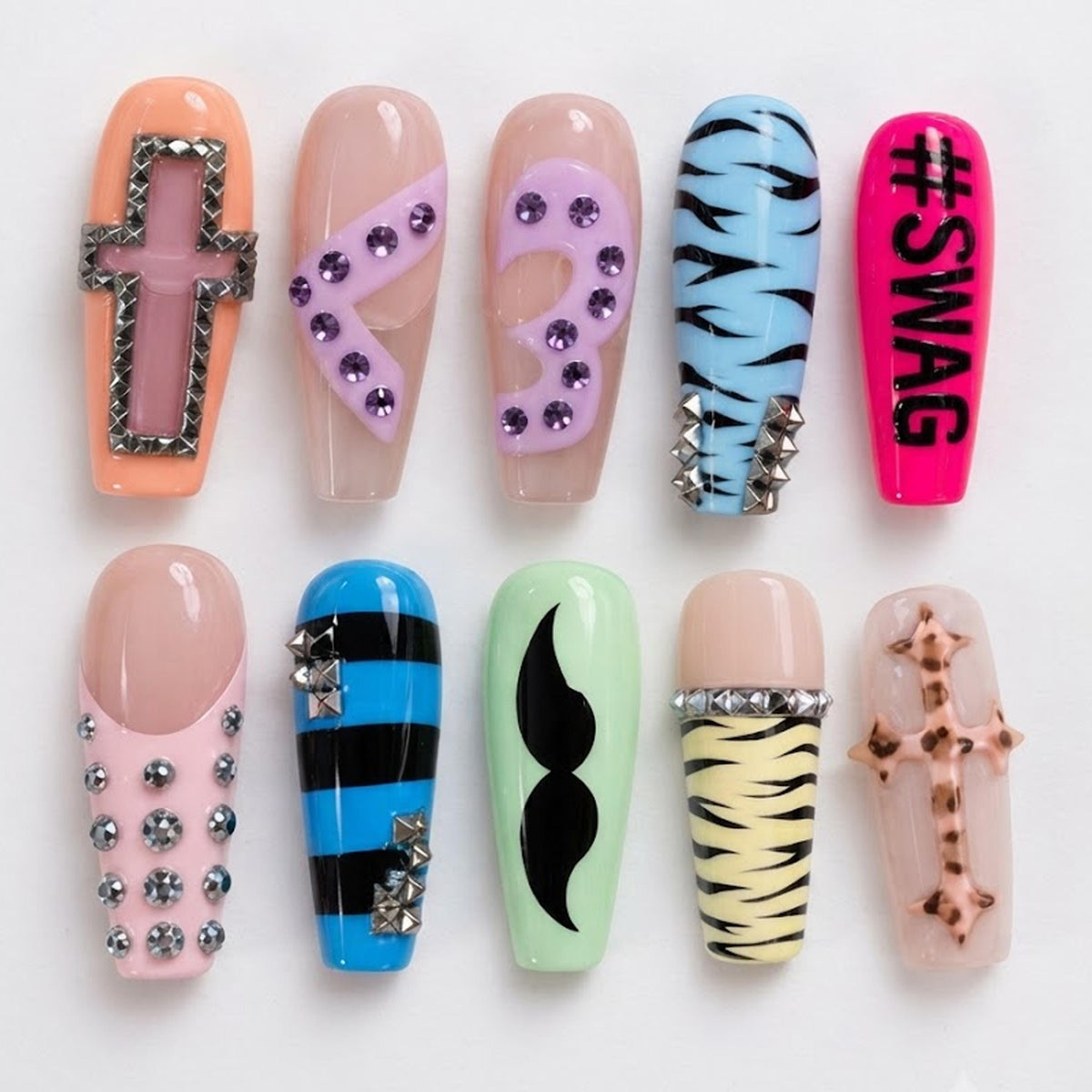 Y2K Scene Nails With Zebra Print, Rhinestone Crosses, and Neon Details
