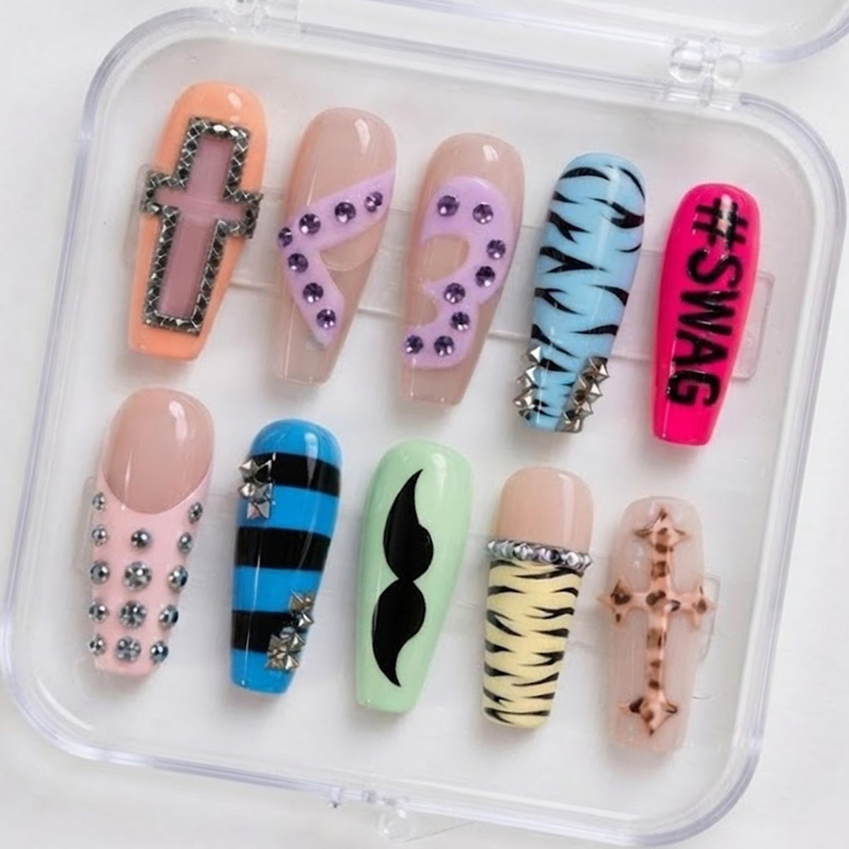 Y2K Scene Nails With Zebra Print, Rhinestone Crosses, and Neon Details